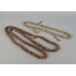 A string of tibetan nut mala beads, 20th century, 90cm long, and a set of bone beads with