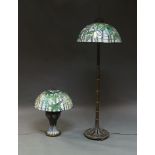 A Tiffany style standard lamp, of recent manufacture, the coloured glass and leaded shade with