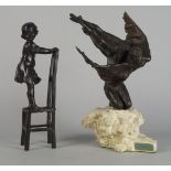 A bronze model of a girl on a chair, 20th century, 31.5cm high, together with a composition model of