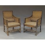 A pair of oak and caned armchairs, early 20th Century, the caned backrest and arms, above