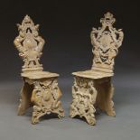 A matched pair of 16th Century style Italian limed wood 'Sgabello' hall chairs, 20th Century, the