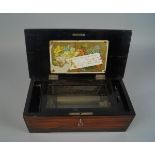 A faux rosewood music box, probably Swiss, Late 19th/early 20th century, playing six aires, the
