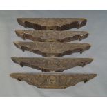 A group of five South East Asian wooden carved lintels, late 19th/20th century, with central