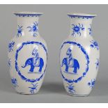 A pair of Chinese porcelain blue and white printed vases, 20th century, decorated with panels of