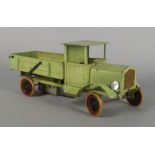 A Doll & Cie Truck, 20th century, painted green with an open work back and hinged tail lift, 36cm