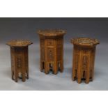 A set of three similar Middle Eastern hardwood, ebonised and mother of pearl inlaid octagonal