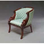 An Empire style mahogany and upholstered armchair, 20th century , the curved back with scrolling