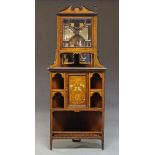 An Edwardian rosewood and marquetry inlaid corner cabinet, the top with broken pediment and turned