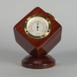 An Asprey & Co desk time piece, in the form of a revolving cube, on a circular stand, with clock,