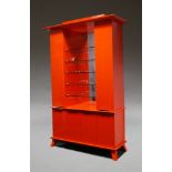 A large red lacquer and mirrored cabinet, of recent manufacture, the mirrored back with glass