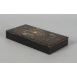 A Japanese lacquer rectangular box, 19th century, the lid decorated with mother of pearl trailing