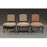A set of three Louis XV style rosewood side chairs, each with upholstered seat and backrest, the