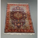 A Shiraz rug with pole medallion in deep red field, 136cm x 111cm and a West Persian rug, 190 x