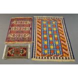 A polychrome shiraz kelim, 156cm x 99cm, a machine made silk rug 102cm x 70cm, and a small turkish