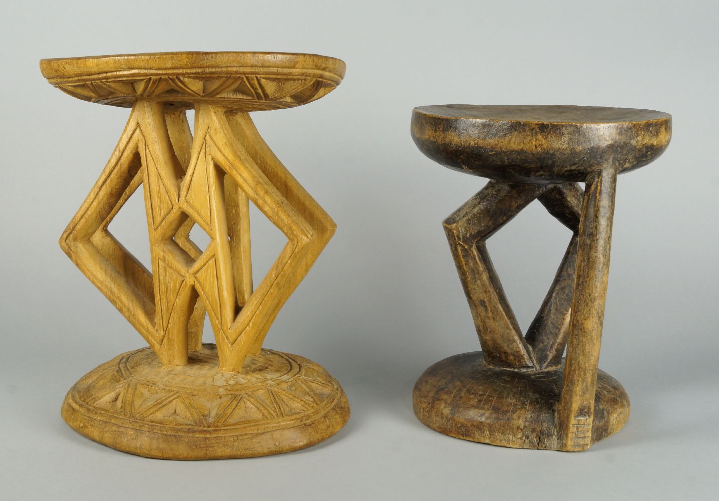 Two African hardwood Tribal stools, 20th century, 28 and 31cm high (2) some water staining noted,