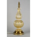 A Venetian glass lamp, 20th century, of double gourd ridged form with an adventurine finish, on a