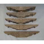 A group of five South East Asian wooden carved lintels, late 19th/20th century, with central