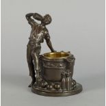 A bronzed copper electrotype figure of a boy drinking at a well, 20th century, with a brass bowl