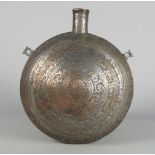 A copper and zinc round pilgrims flask, late 19th century, decorated with concentric rings of