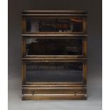 A Globe Wernicke three-section stacking bookcase, with three glazed graduated sections, over one