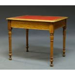 A Victorian oak writing table, the rectangular top inset with red leather writing surface, raised on