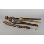 A long African hardwood knobkerrie, 19th/20th century, 69cm long, together with a similar shorter