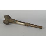 A Tibetan white metal and metal trumpet, late 19th/20th century, in the form of a femur bone,