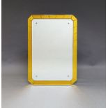A rectangular bevelled mirror, 20th Century, possibly French, with amber coloured glass border