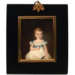 English School, early 19th century- A portrait miniature of a young girl seated three-quarter length