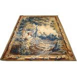 An Aubusson tapestry wall hanging, with rose entwined border, enclosing a verdure landscape scene