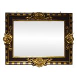 A Spanish ebonised and parcel gilt wall mirror, 18th century, mirror with centred shell motifs, with