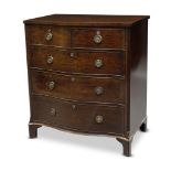 A George III mahogany serpentine chest of drawers, with two short over three long graduated drawers,