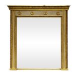 A Victorian carved gilt wood and white painted overmantel mirror, with ogee leaf cornice above