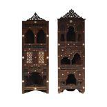 A matched pair of Moorish Mashrabiya work corner cabinets, early 20th century, each profusely carved