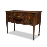 A Regency mahogany and line strung serpentine sideboard, with two central drawers flanked by a