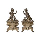 A pair of French brass chenet, late 19th century, each modelled with a boy and girl playing with