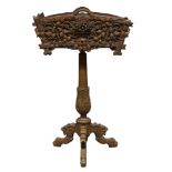 A Black Forest carved linden wood jardinière stand, late 19th / early 20th Century, the