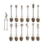 An Italian cased set of twelve gilt teaspoons, with sell form bowls, writhen stems and unusual