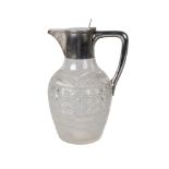 A silver mounted cut glass claret jug, Sheffield c.1909, James Deakin & Sons, the hinged cover