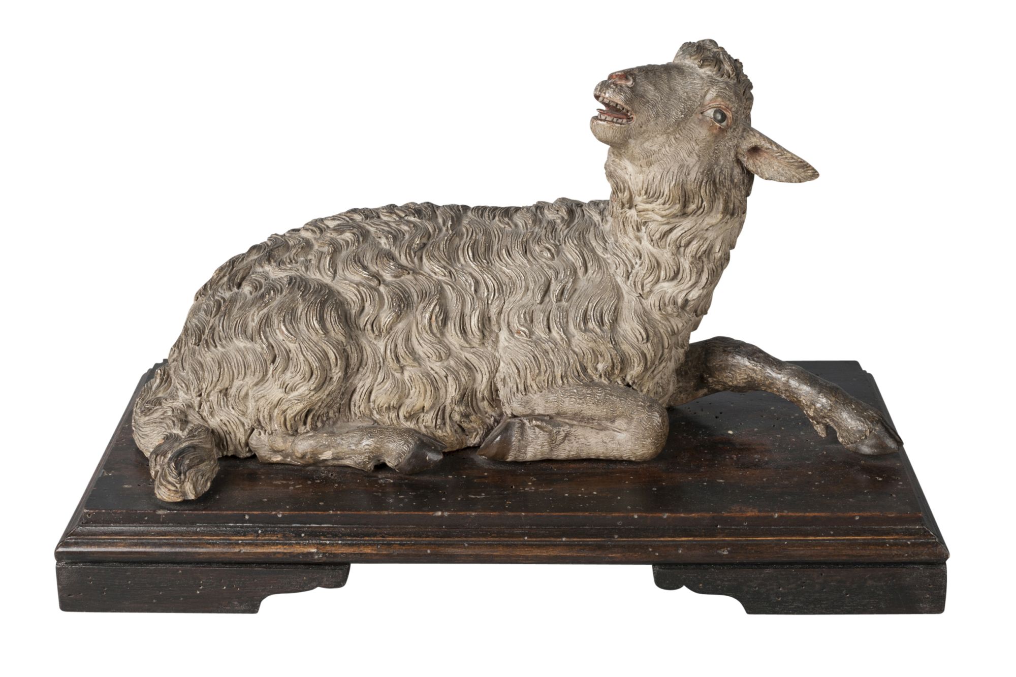 A Continental painted terracotta model of a lamb, probably Italian, 18th century, naturalistically