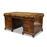 A burr walnut and mahogany pedestal desk, early 20th Century, the rectangular top inset with leather