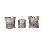 A pair of embossed silver wine holders, London c.1892, William Commyns, with border of birds