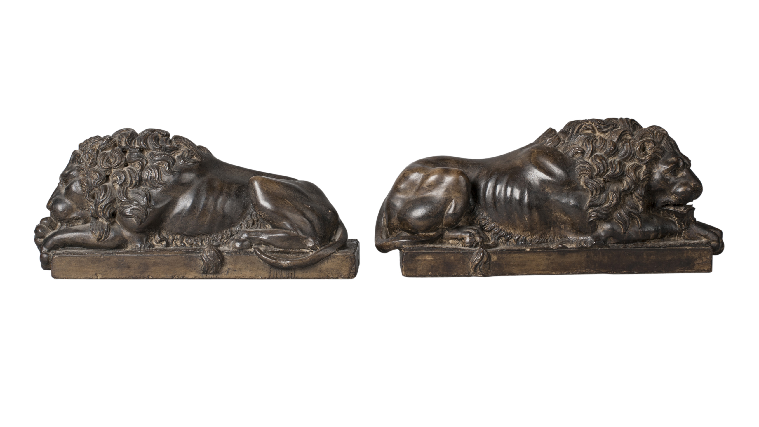 A pair of pottery lions, after Canova, 20th century, modelled seated on plinths, 37cm wide (2)