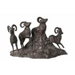 A bronze sculpture group of four mountain rams, late 19th/early 20th century, modelled standing on a