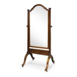 An Edwardian mahogany and line inlaid cheval mirror, of arched form on scrolling end supports to