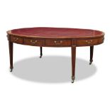 A George III inlaid mahogany oval library table, c.1780, the tulipwood cross banded top inset with