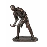 Vittorio Guttner (1869-1935) A bronze model of a hockey player, signed to base, with foundry stamp