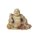 A Chinese soapstone carving of Hotei, 18th/19th century, carved seated, with characteristic