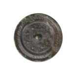 A Chinese bronze 'TVL' mirror, Han dynasty, centred with a raised knob surrounded by eight studs and