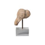 An Indian terracotta fragment, Shunga period, 3rd-2nd century BCE, modelled the head of a deity, 6cm